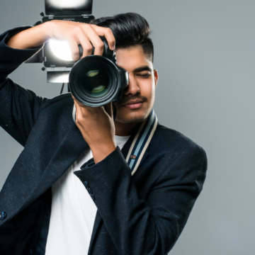 Professional indian photographer taking photos in studio with leight