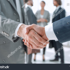 stock-photo-closeup-reliable-handshake-of-business-partners-1929471071