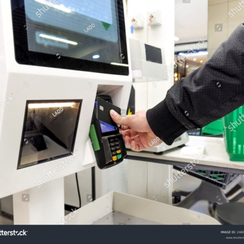 stock-photo-customer-pays-his-purchase-at-the-supermarket-self-checkout-systems-in-retail-stores-barcode-2460071081