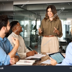 stock-photo-happy-middle-aged-business-woman-executive-ceo-leader-discussing-project-management-planning-2424450089