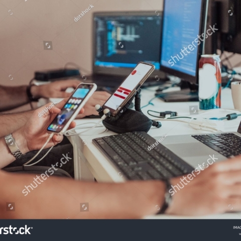 stock-photo-programmers-engrossed-in-deep-collaboration-diligently-working-together-to-solve-complex-problems-2311435351