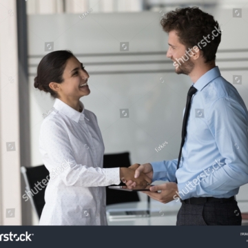 stock-photo-two-happy-confident-diverse-business-people-shaking-hands-in-office-smiling-laughing-talking-2179177833