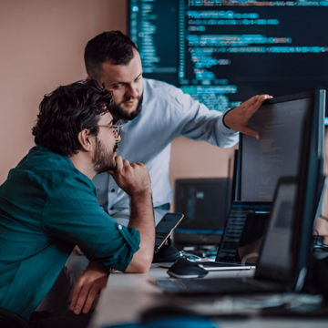stock-photo-programmers-engrossed-in-deep-collaboration-diligently-working-together-to-solve-complex-problems-2311435427 stock-photo-programmers-engrossed-in-deep-collaboration-diligently-working-together-to-solve-complex-problems-2311435427